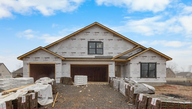 unfinished property with a garage