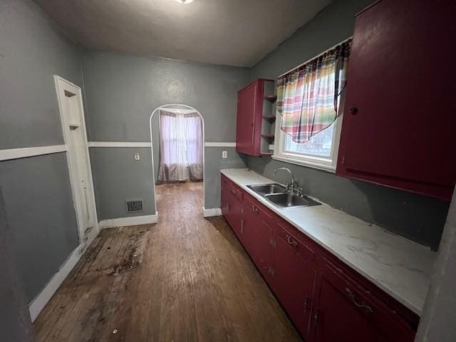 kitchen featuring sink and wood-type flooring