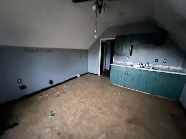 kitchen featuring sink and vaulted ceiling