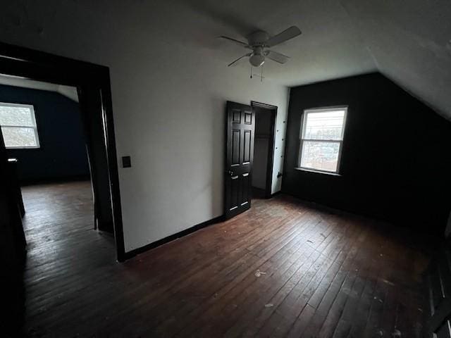 bonus room featuring vaulted ceiling, dark hardwood / wood-style floors, and ceiling fan