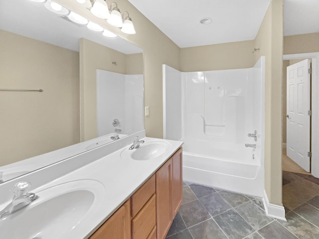 bathroom with tile patterned flooring, vanity, and shower / bathtub combination