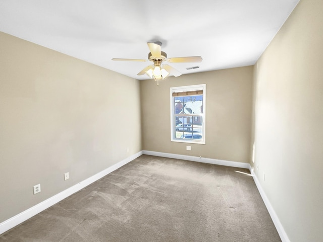 carpeted empty room with ceiling fan