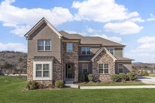 craftsman-style house with a front lawn