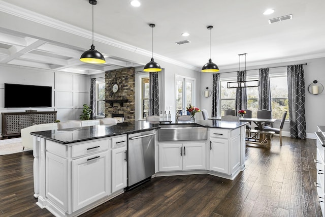 kitchen featuring hanging light fixtures, dark hardwood / wood-style floors, an island with sink, white cabinets, and stainless steel dishwasher