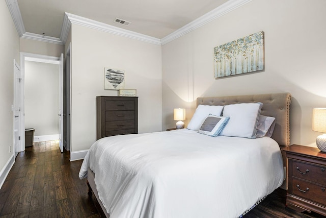 bedroom featuring dark hardwood / wood-style flooring and crown molding