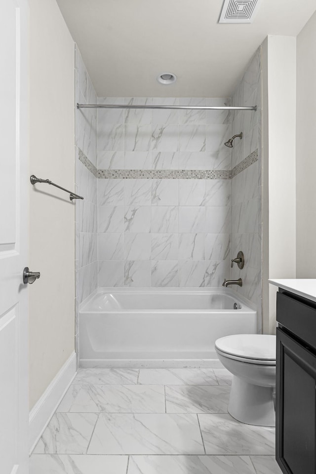 full bathroom featuring vanity, toilet, and tiled shower / bath