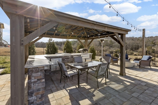 view of patio featuring a gazebo, a grill, and area for grilling