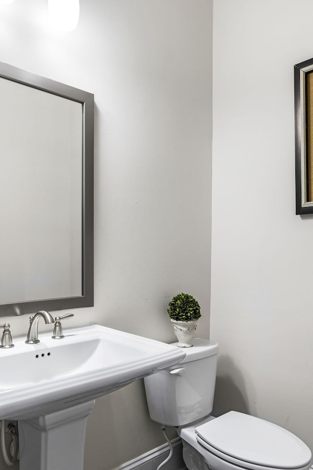 bathroom featuring sink and toilet