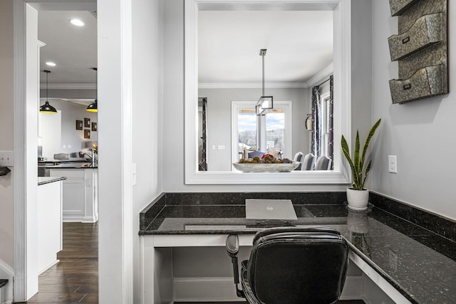 interior space with sink, wood-type flooring, and ornamental molding