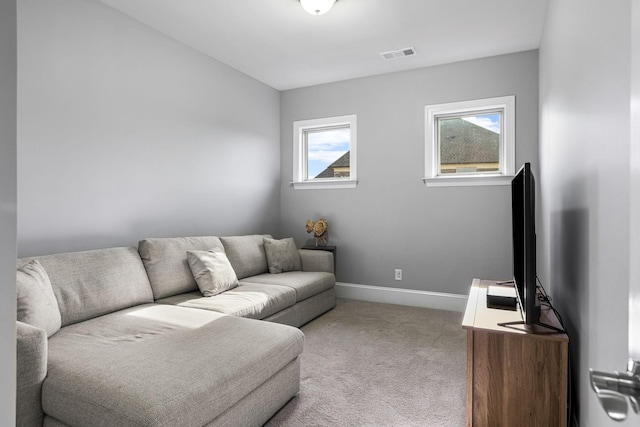 living room featuring light colored carpet