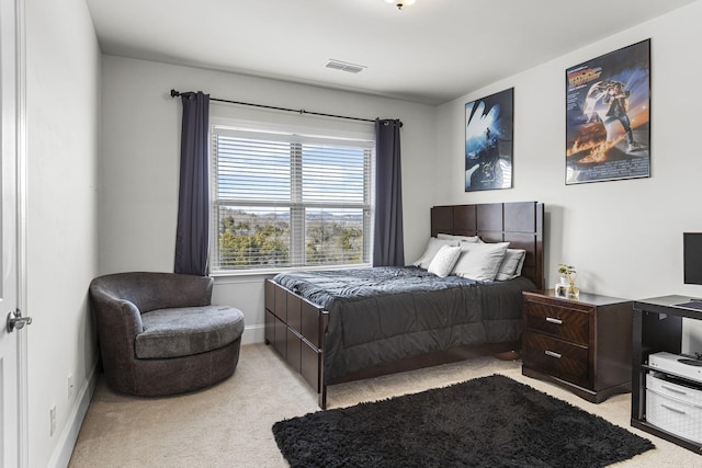 bedroom with light colored carpet