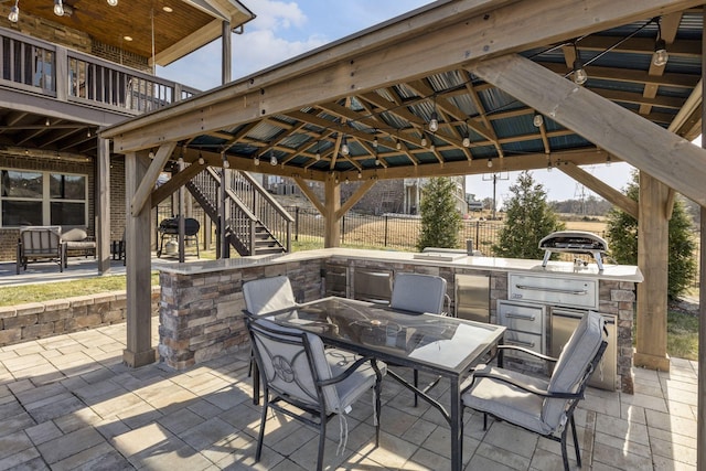 view of patio / terrace featuring a gazebo and area for grilling