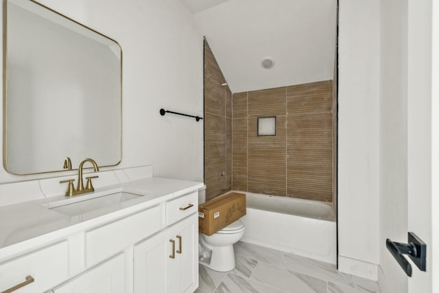 full bathroom with vanity, toilet, and tiled shower / bath combo