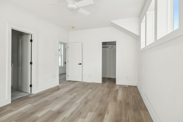 unfurnished bedroom featuring a closet, ceiling fan, and light hardwood / wood-style flooring