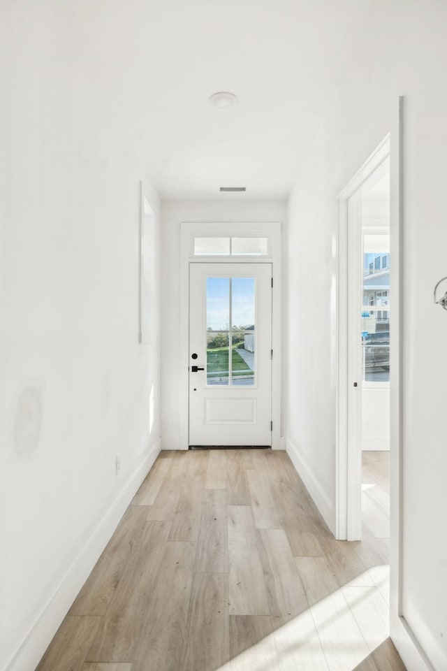 doorway to outside featuring light hardwood / wood-style flooring