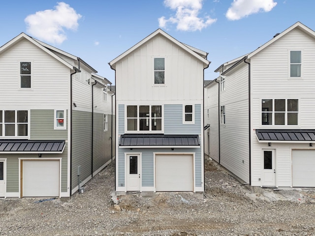 back of house with a garage