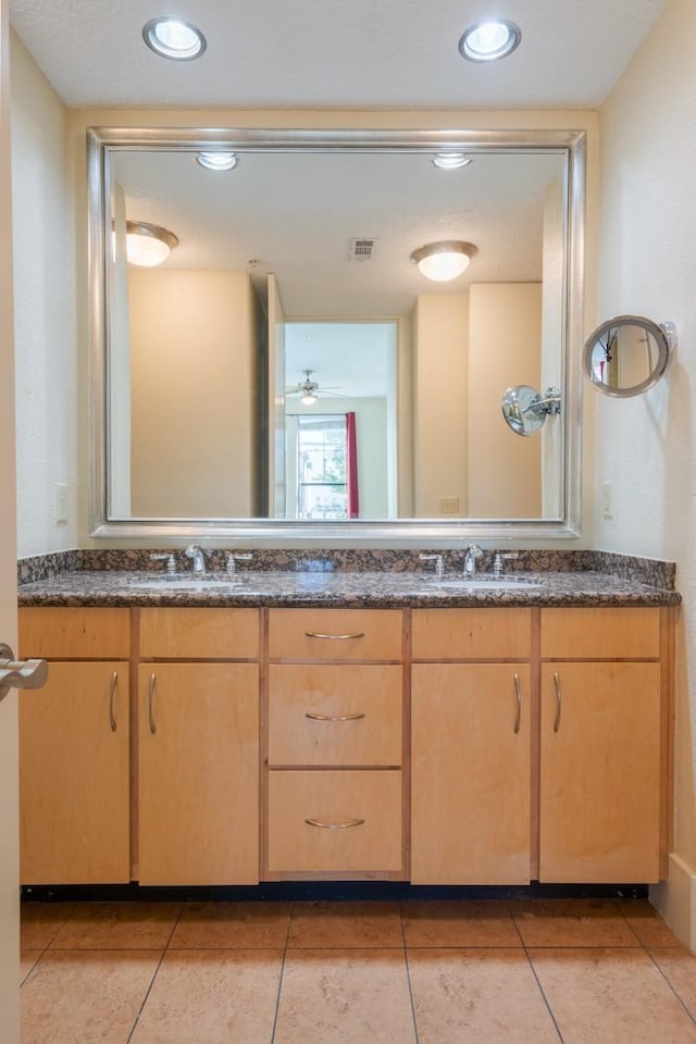 bathroom featuring vanity and tile patterned flooring