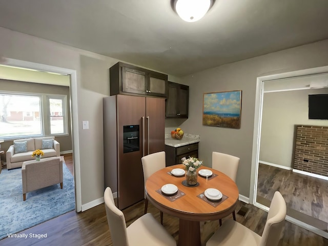 dining area with dark hardwood / wood-style floors