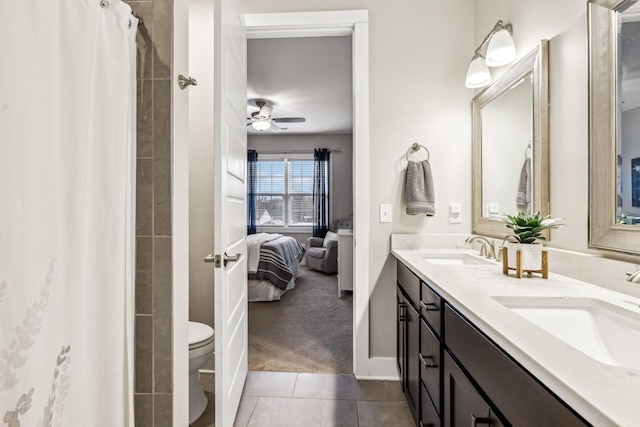 bathroom with tile patterned flooring, vanity, ceiling fan, toilet, and a shower with shower curtain