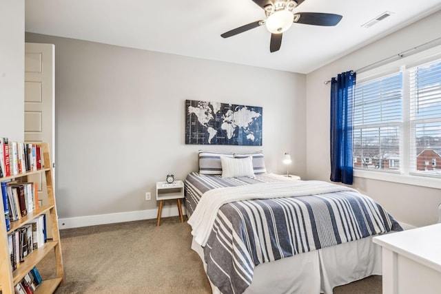 carpeted bedroom with ceiling fan