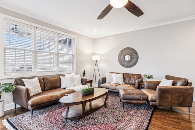 living room featuring ornamental molding, dark hardwood / wood-style floors, and ceiling fan