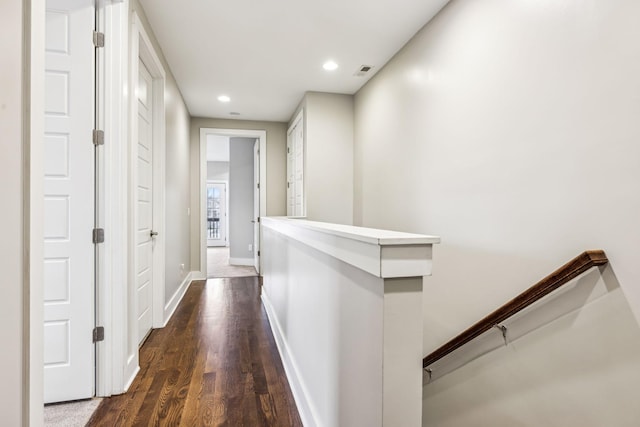 hallway featuring dark hardwood / wood-style flooring