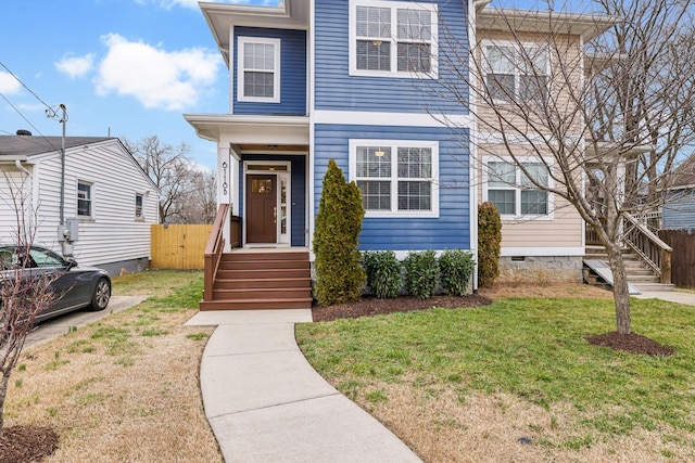 view of front of property with a front lawn