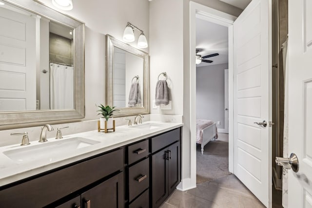 bathroom with walk in shower, ceiling fan, and vanity