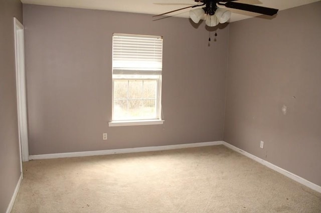 carpeted empty room with ceiling fan