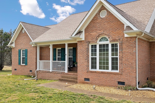 view of front of home with a front yard and covered porch