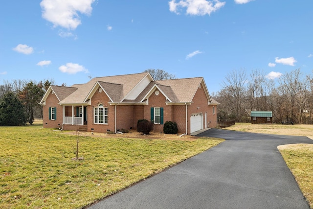 single story home with a garage, covered porch, and a front lawn