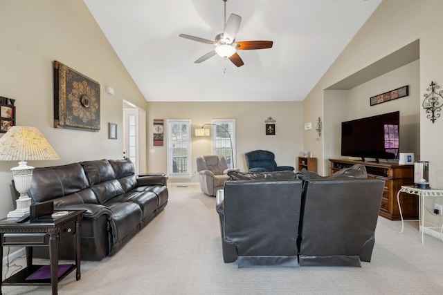 carpeted living room with high vaulted ceiling and ceiling fan