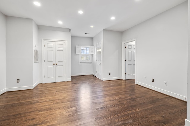 interior space with dark hardwood / wood-style floors