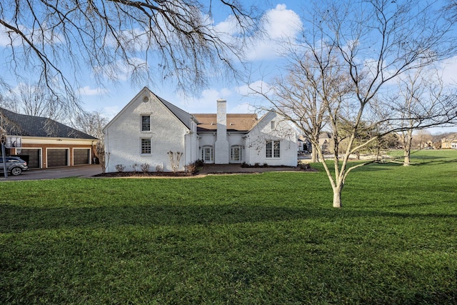 view of front of home featuring a garage and a front lawn