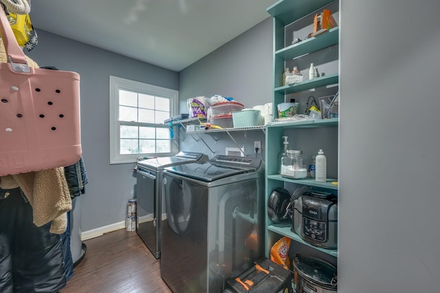 clothes washing area featuring dark wood-type flooring and independent washer and dryer