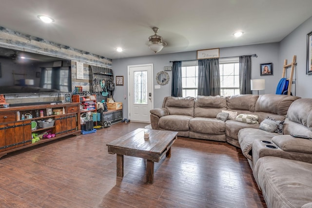 living room featuring a wealth of natural light and dark hardwood / wood-style floors