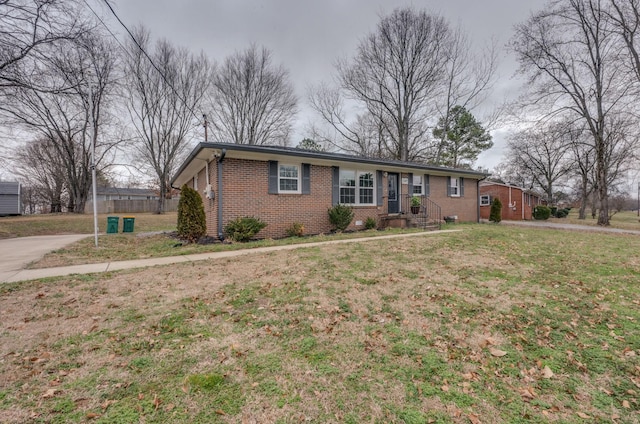 ranch-style house with a front lawn