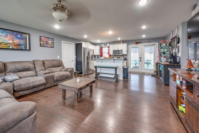 living room featuring dark hardwood / wood-style flooring and french doors