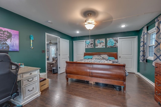 bedroom with dark wood-type flooring and ceiling fan