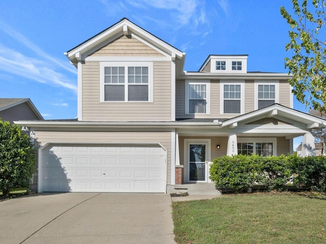 view of front facade with a garage and a front yard