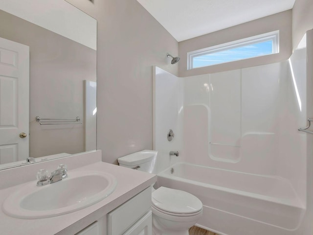 full bathroom featuring toilet, vanity, and shower / bathing tub combination