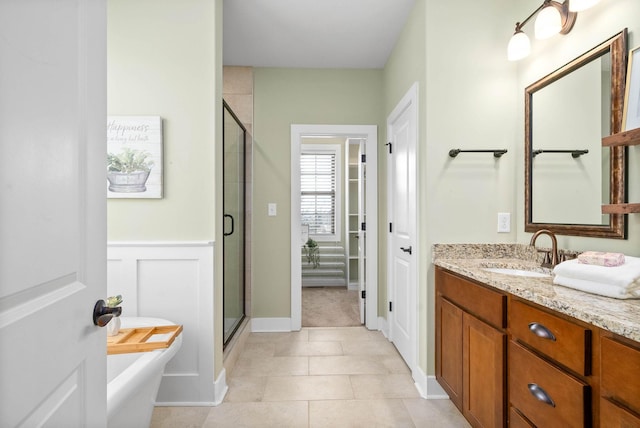 bathroom featuring vanity, tile patterned flooring, and shower with separate bathtub