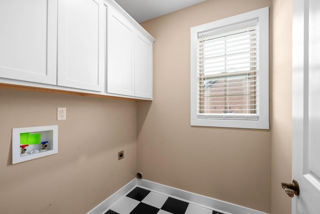 clothes washing area featuring cabinets, hookup for a washing machine, and electric dryer hookup