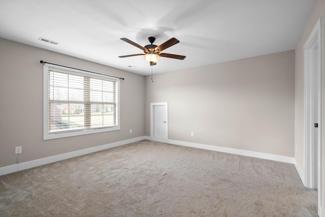 carpeted empty room with ceiling fan