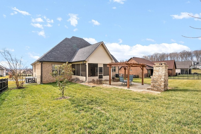 back of property featuring a pergola, a lawn, a sunroom, and a patio