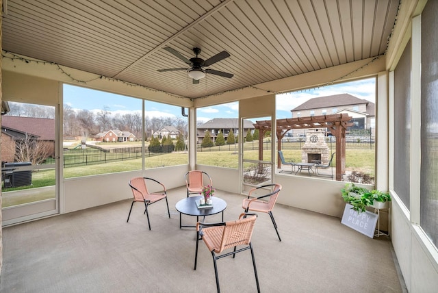 sunroom / solarium with ceiling fan