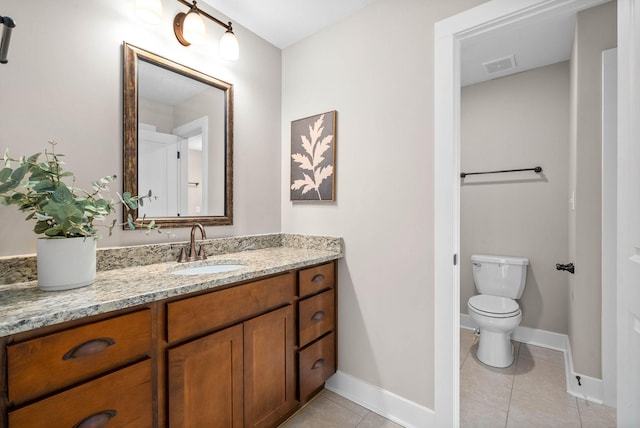 bathroom with tile patterned floors, toilet, and vanity