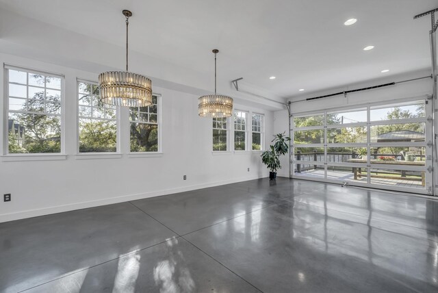 unfurnished dining area with a notable chandelier