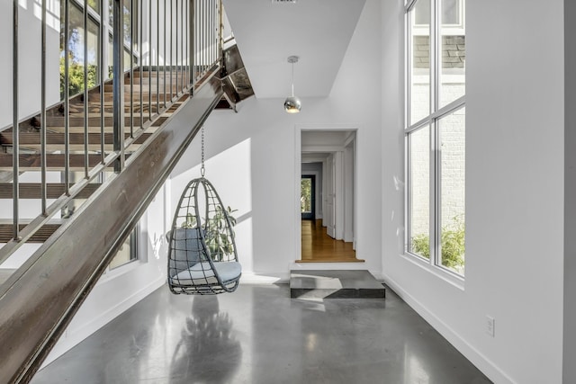 foyer entrance featuring concrete flooring