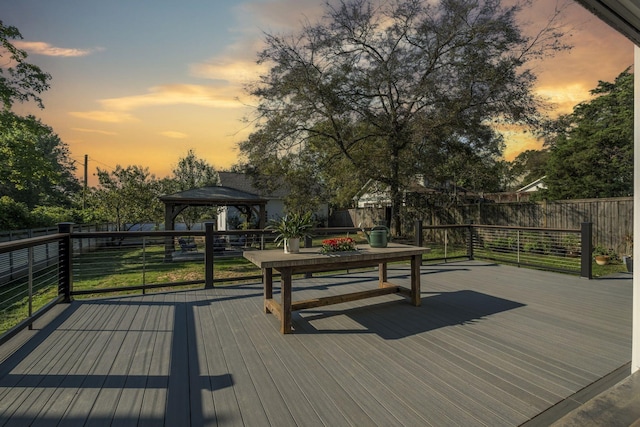 deck at dusk with a gazebo